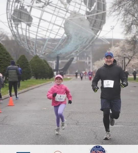 Todd running a race with his daughter Addie